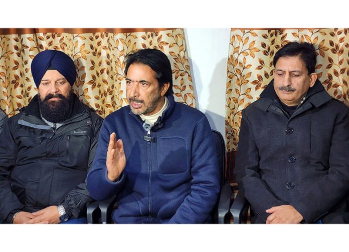 AICC General Secretary G.A. Mir addressing a press conference in Srinagar on Tuesday. -Excelsior/Shakeel