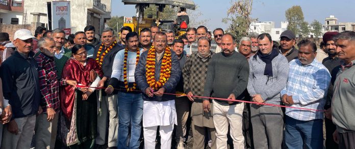 MLA Vijaypur, Chander Parkash Ganga kick starting macadamization of road in Vijaypur on Tuesday.