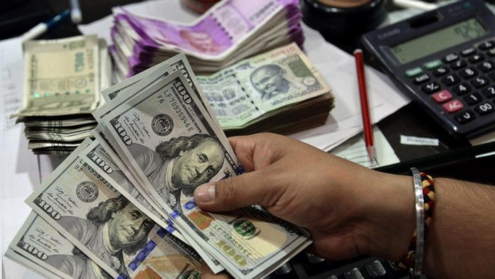 Rupee settles on a flat note near  all-time low at 84.85 against US dollar