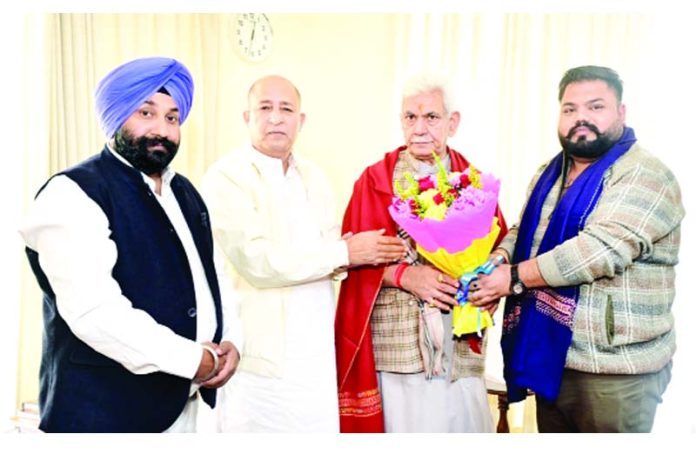 JDU J&K chief G M Shaheen and others presenting a bouquet to LG Manoj Sinha at Raj Bhavan, Jammu.