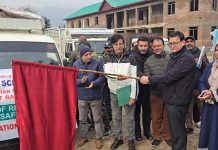 DC Baramulla flagging of vehicles carrying rice bin for distribution to schools on Thursday.