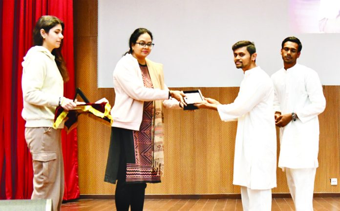 Yoga Instructors from Isha Foundation being presented memento by IIM Jammu.