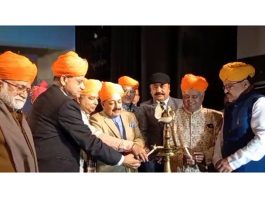 Union Minister Dr Jitendra Singh and other dignitaries lighting the lamp at a function in Jammu on Sunday.