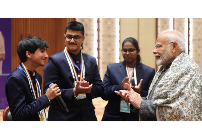 Prime Minister Narendra Modi interacting with PMRBP awardees, including those from J&K, at the ‘Veer Baal Diwas’ programme at Bharat Mandapam in New Delhi on Thursday. (UNI)