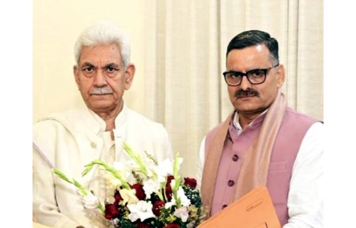 BJP leader, Sanjay Baru presenting a bouquet to Lt Governor, Manoj Sinha during his meeting with latter at Jammu on Tuesday.