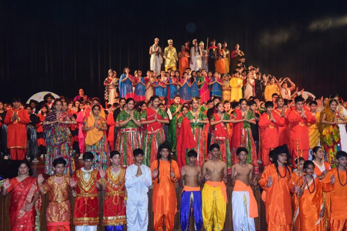 Students of KC Public School posing for a group photograph in traditional dresses during the school's 26th Annual Function.