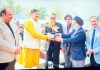 MP Jugal Kishore Sharma receiving plant during annual day event of IDPS Akhnoor.