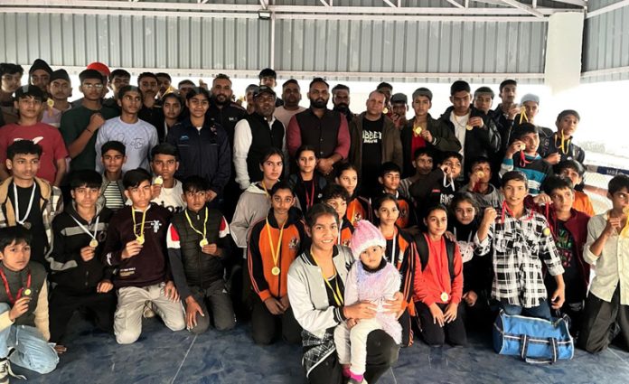 Boxers posing along with medals during prize distribution ceremony at Kathua.