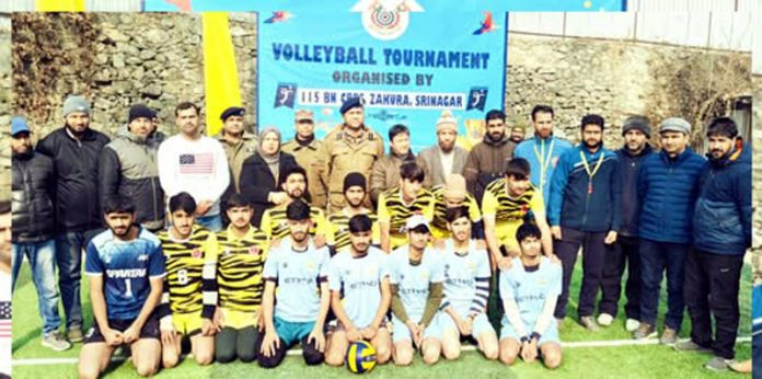 Players posing along with dignitary during prize distribution ceremony.