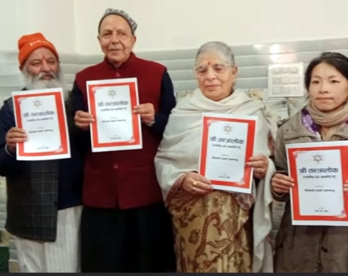 Scholars unveiling Sri Tantraloka discourse transcription in Kashmiri at Jammu on Saturday.