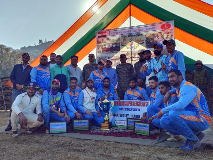 Players posing along with trophy at Mendhar on Monday.