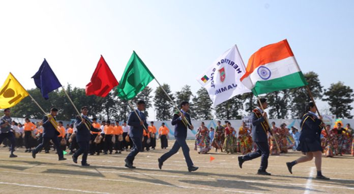 Students of Heritage School proudly holding flags during the 20th Annual Sports Day celebrations on Monday.