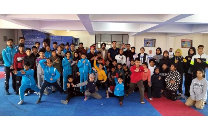 Sub Junior Wushu team posing along with others.