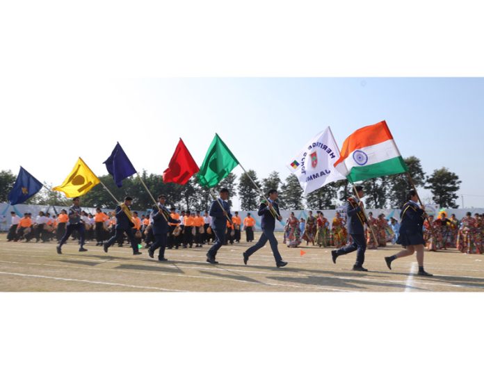 Students of Heritage School proudly holding flags during the 20th Annual Sports Day celebrations on Monday.