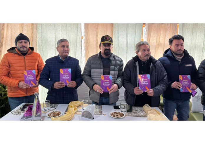 CEC LAHDC Kargil Dr M J Akhoon & others releasing a book of Kacho Hassan Khan during an event on Monday.