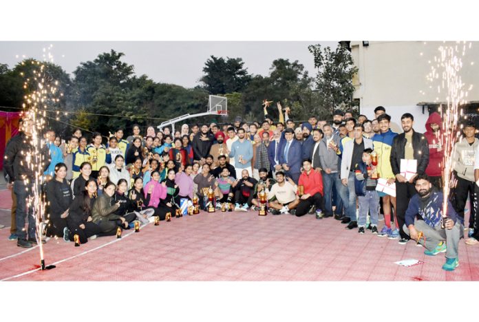 Dignitaries posing along with Basketball players during prize distribution ceremony at MA Stadium Jammu.