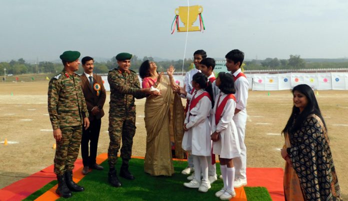 Major General Mukesh Bhanwala, releasing colorful balloons at APS Sunjuwan.