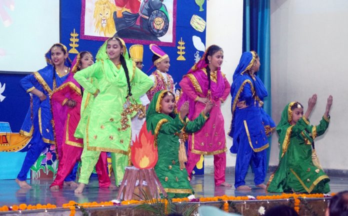 Students performing cultural item during Annual Day event on Monday.