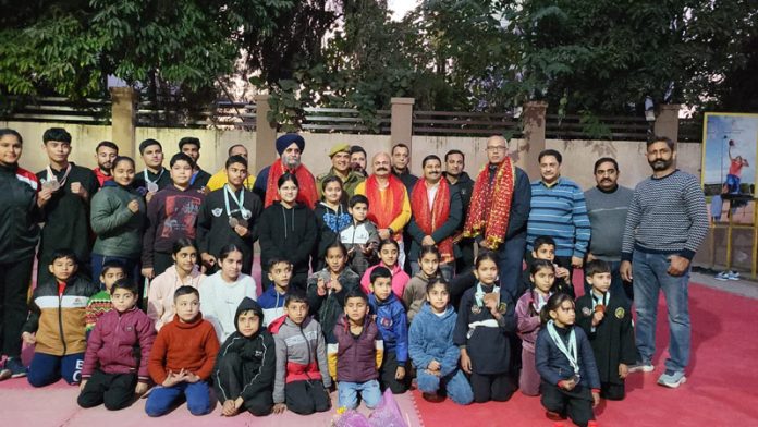 Medal winners posing along with dignitaries during felicitation programme at Jammu.