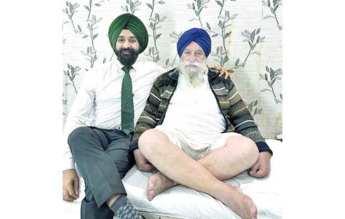 Dr Ranjit Singh posing with a patient on whom he performed both knee replacement surgery.