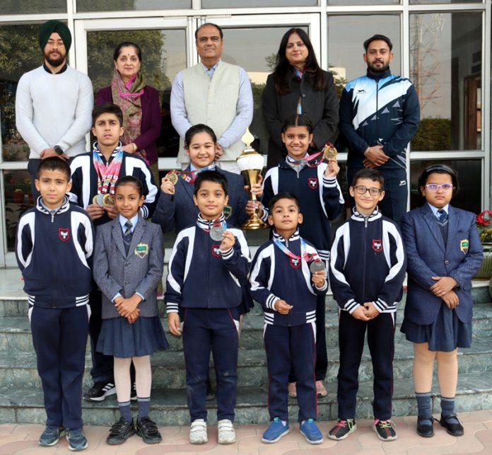 Top performers of 62nd National Roller Skating Championship posing along with school management.