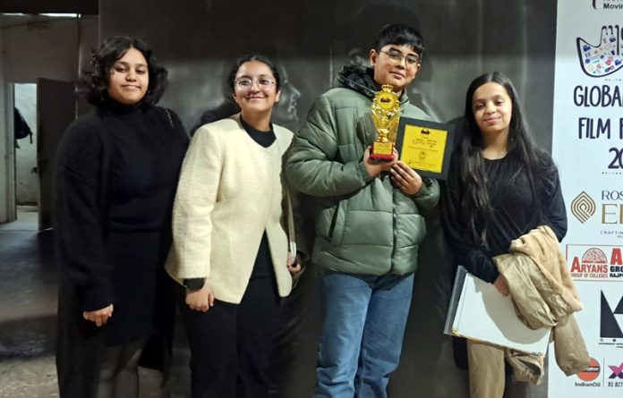 Saransh Tikku posing with 'Best Male Actor' trophy in junior category during Global Youth Film Festival (GYFF) in Chandigarh.