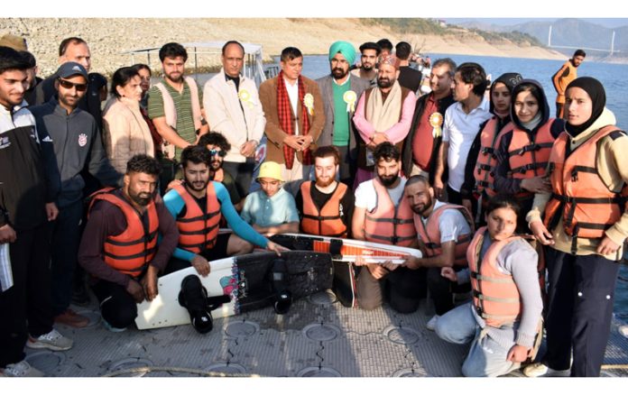 Dignitaries posing along with water sports athletes at Ranjit Sagar Dam in Basohli, Kathua.