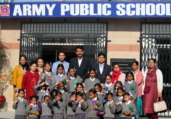 Govt. Middle School, Mandi Garh students posing along with APS Samba management.