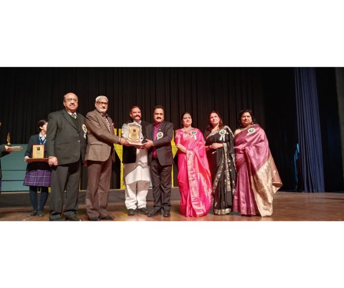 Sham Lal Sharma, MLA Jammu North, receiving memento during the Annual Day celebration of Cambridge International School.