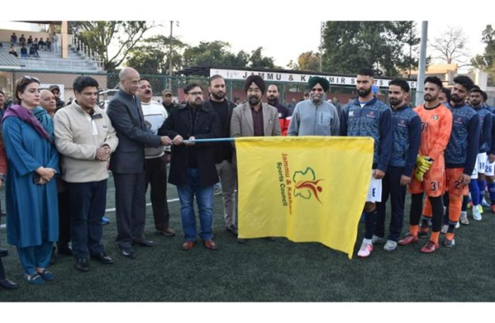 Sports Minister Satish Sharma flagging off J&K Football team for Santosh Trophy on Wednesday.