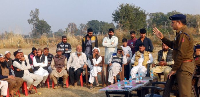 A police officer interacting with the Gujjar community members during a police-public meeting at Kanachak area on Friday.