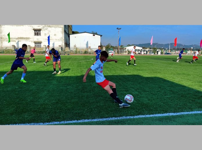 Football players in action during a match at Jammu on Monday.