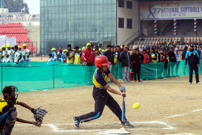 Softball players in action during a match at MA Stadium Jammu.