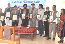 Artists posing with the Chief Guest during a camp organised in Jammu on Thursday.