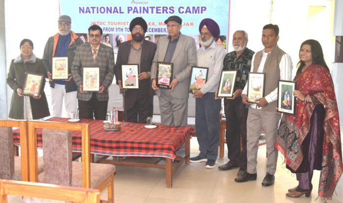 Artists posing with the Chief Guest during a camp organised in Jammu on Thursday.