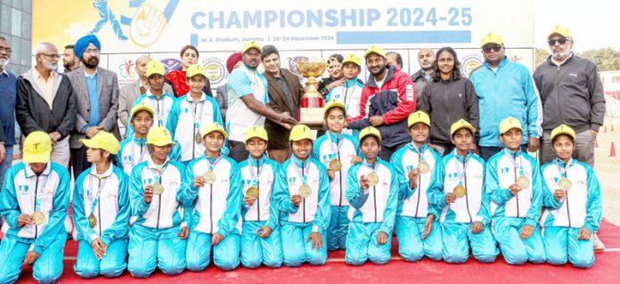 Dignitaries presenting trophy to winning team during prize distribution ceremony of 37th Sub Junior National Softball Championship at MA Stadium Jammu.