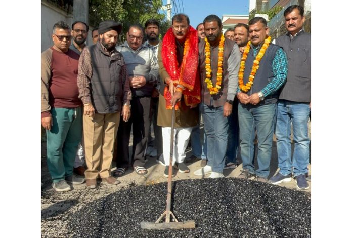 MLA Jammu West, Arvind Gupta kick starting blacktopping of lane in Ward 40 on Monday.