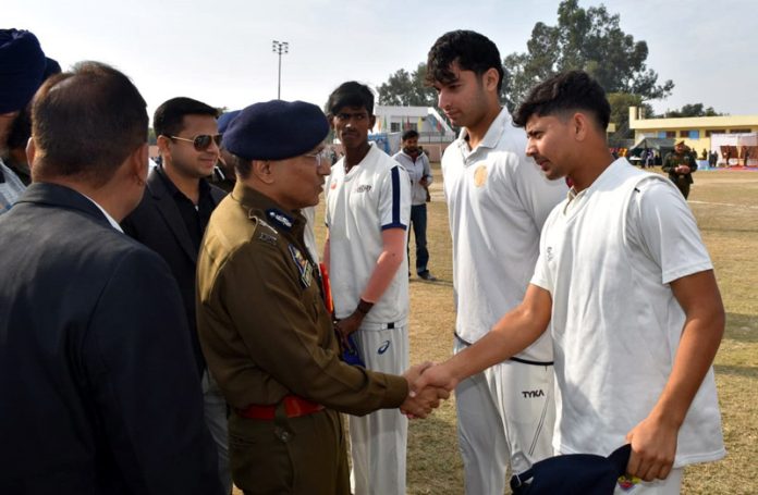 ADGP Jammu Zone Anand Jain interacting with players during a cricket tournament.