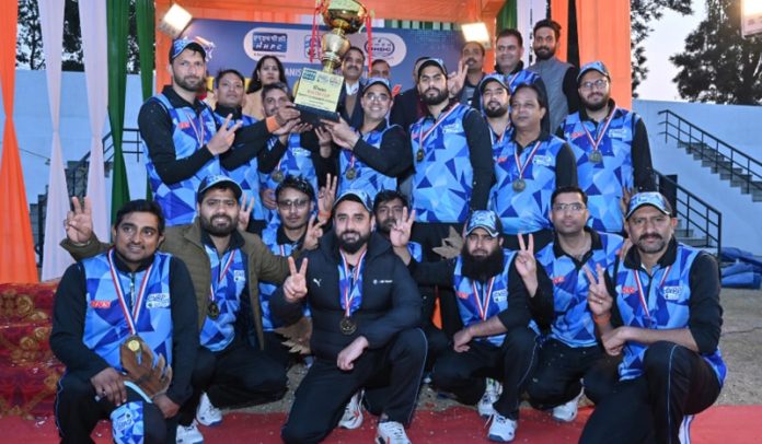 Winning team posing along with trophy.