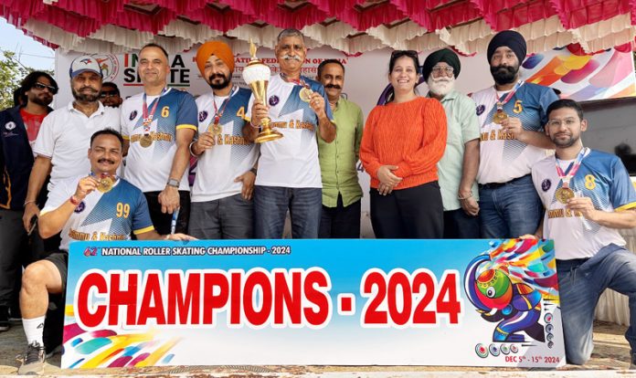 J&K Roller Hockey team posing along with trophy.