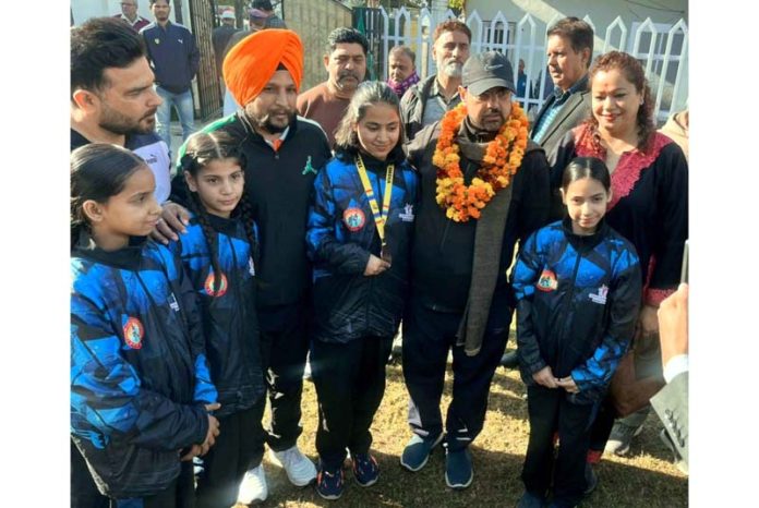 YS&S Minister, Satish Sharma posing along with Taekwondo players.