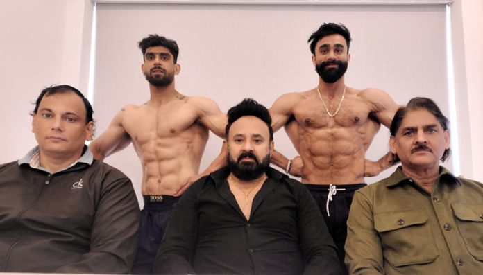 Bodybuilders posing along with dignitaries.