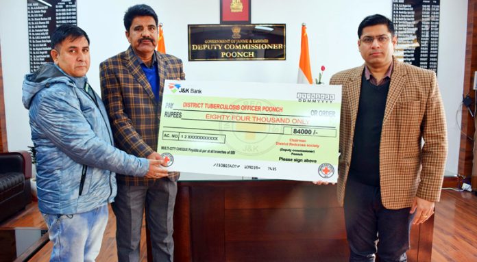 CMO Poonch Dr Parvaizm Khan getting the cheque for TB patients from DC Poonch Vikas Kundal.