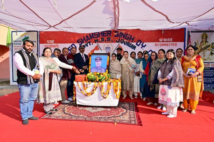 MLA Akhnoor Mohan Lal Bhagat along with others, paying tribute to Shaheed Shamsher Singh in Jourian on Monday.