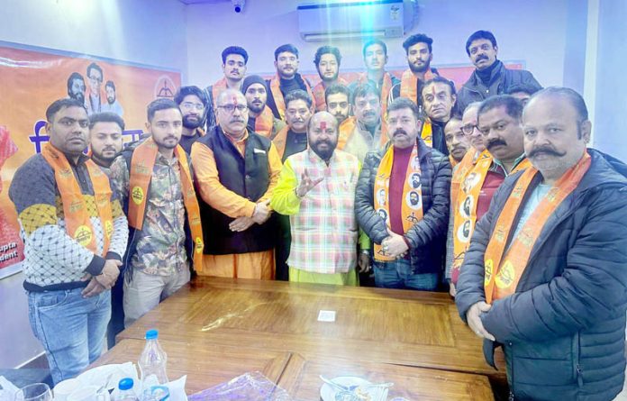 New entrants posing for a photograph after joining Shiv Sena at Udhampur on Monday.