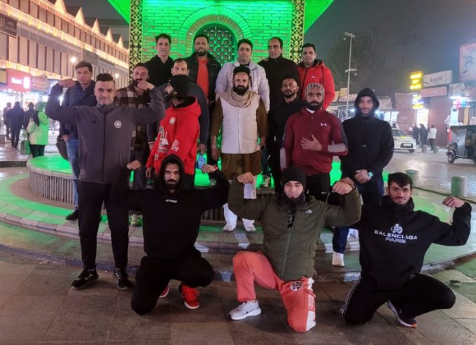 Bodybuilders posing for group photograph at Lal Chowk, Srinagar.