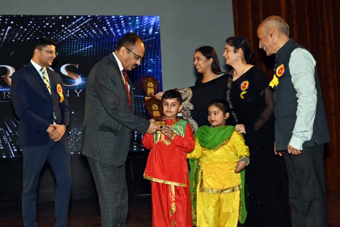 Dignitaries presenting trophy to toddlers during Annual Day event at Jammu.