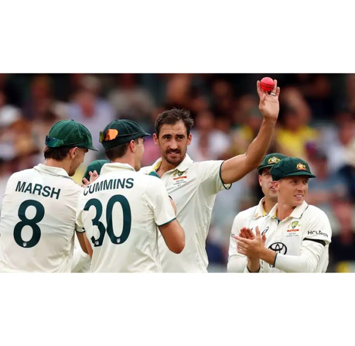 Australia’s Mitchell Starc celebrating with team-mates after devastating spell of 6/48 against India at Adelaide.