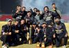 Winning team posing along with a trophy at MA Stadium, Jammu.