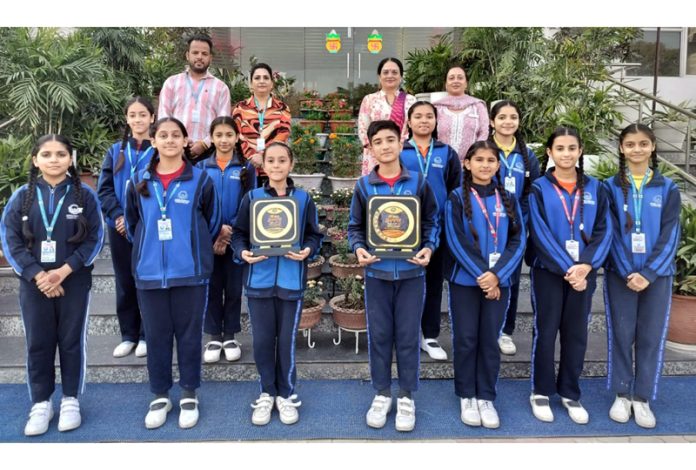 Students of APS Dhar Road Udhampur posing for a photograph.